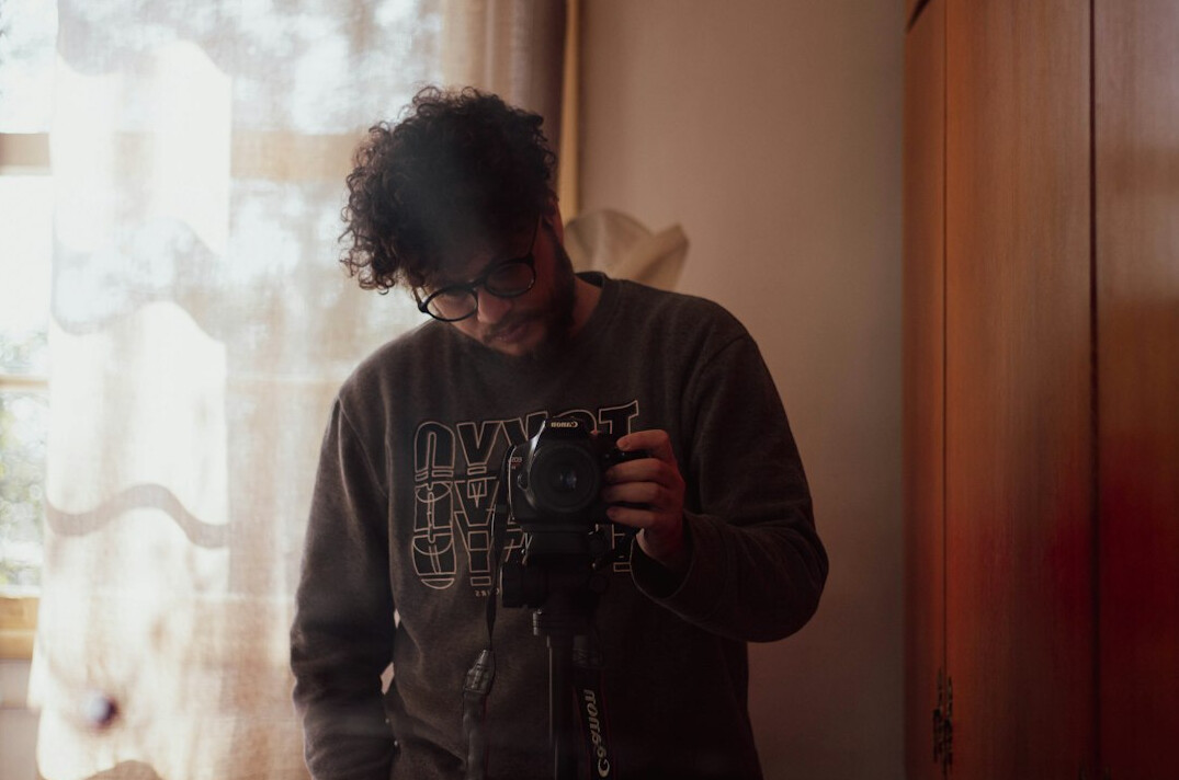 Portrait of a Chilean male documentary photographer with a beard