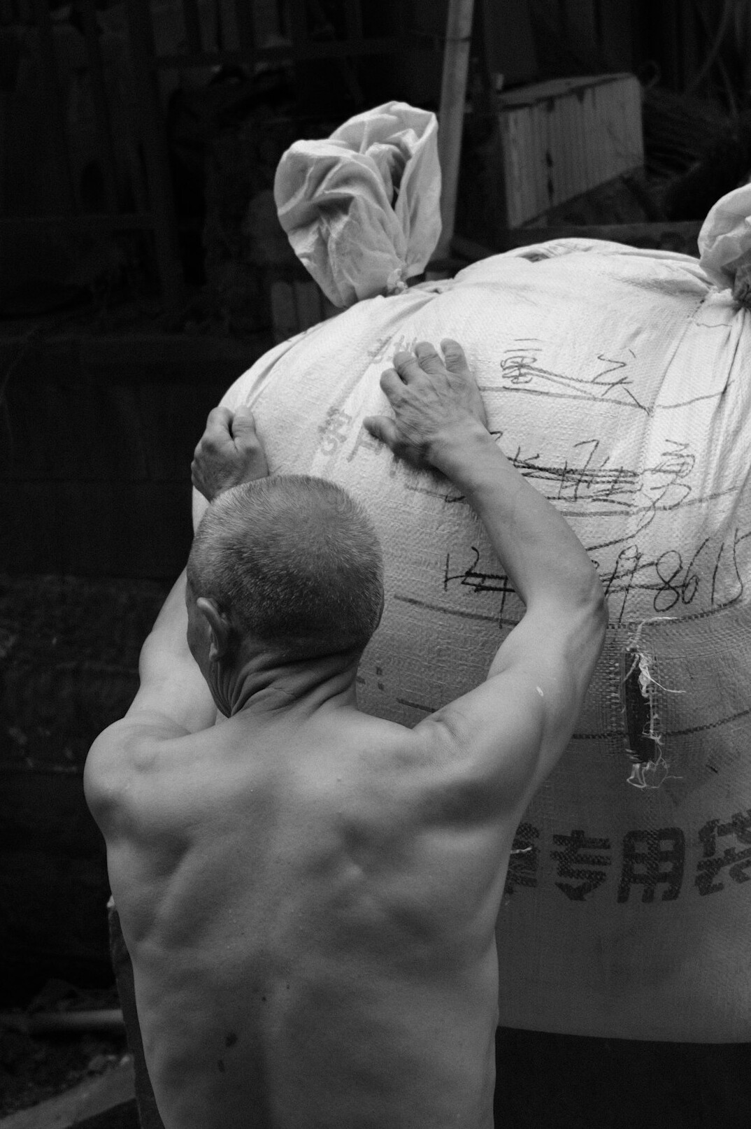 person helping with heavy bag